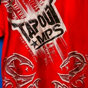 Dominate the competition in style with Tapout's red MPS shirt
